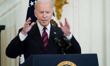 President Joe Biden is calling for a faster drop in gas prices as oil prices decrease. Seen here is Biden speaking during an event at the White House on March 15.