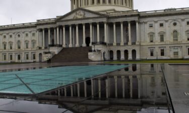 The US Capitol dome and its reflection are seen on Capitol Hill in Washington