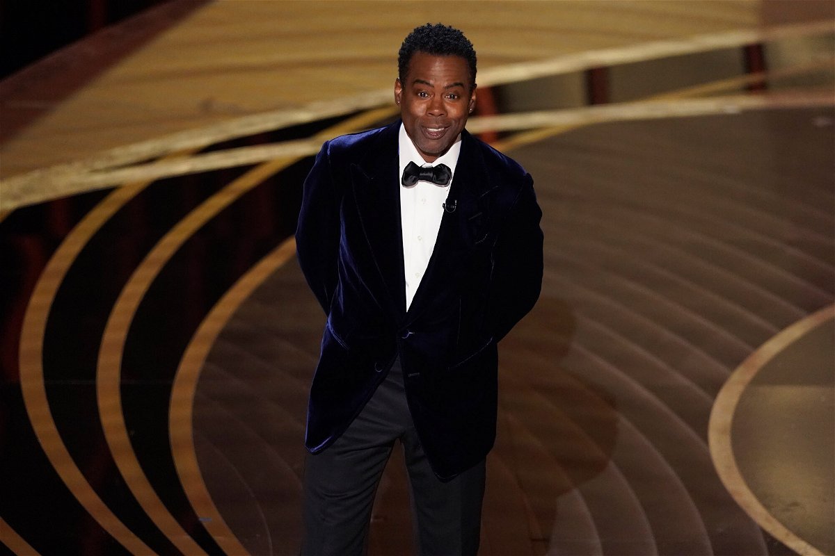 <i>Chris Pizzello/Invision/AP</i><br/>Chris Rock presents the award for best documentary feature at the Oscars on March 27. Chris Rock's brother