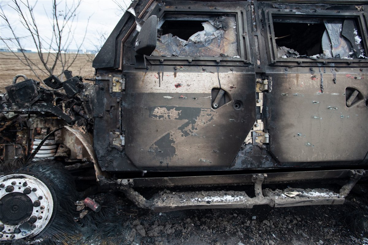 <i>Scott Peterson/Getty Images</i><br/>A burnt-out Russian Tigr fighting vehicle sits along a road in Mykolaiv