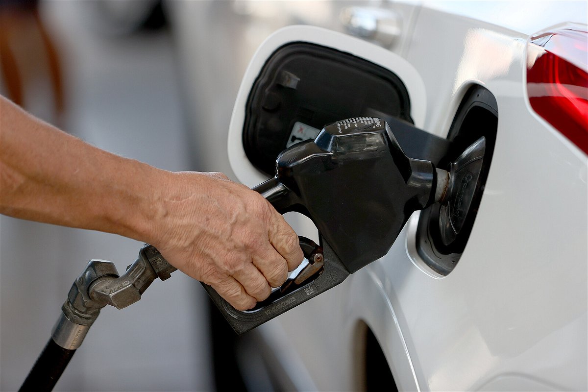 A customer pumps gas into his vehicle at a Shell station on November 22