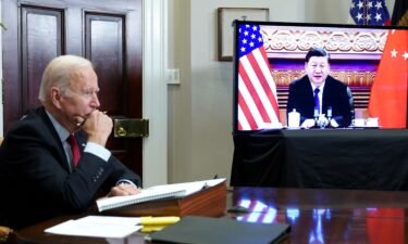 US President Joe Biden meets with China's President Xi Jinping during a virtual summit from the Roosevelt Room of the White House in Washington
