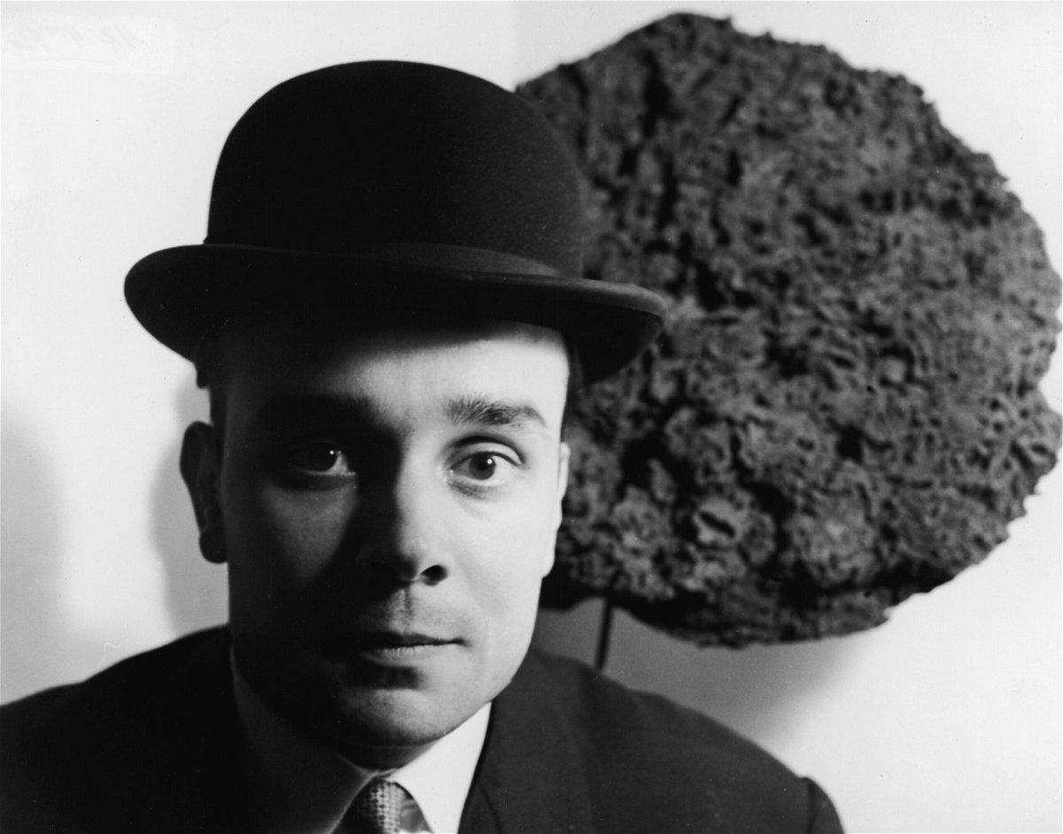 <i>Express Newspapers/Hulton Archive/Getty Images</i><br/>French artist Yves Klein (1928 - 1962) stands in front of one of his Blue Sponge Sculptures in France in the late 1950s.