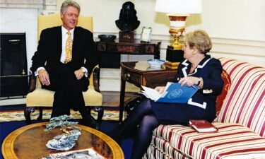 US President Bill Clinton (left) and Secretary of State Madeleine Albright talk together in the White House's Oval Office