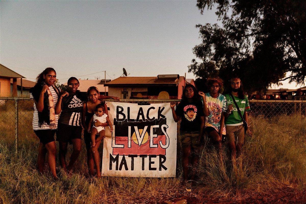 <i>PAW Media/Abby Jane Dunn</i><br/>Children from Yuendumu hold a Black Lives Matter sign on March 11