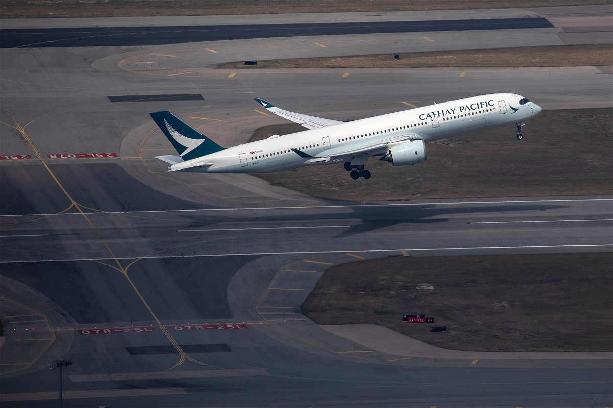 <i>Paul Yeung/Bloomberg/Getty Images</i><br/>An aircraft operated by Cathay Pacific Airways Ltd. takes off from Hong Kong International Airport in Hong Kong