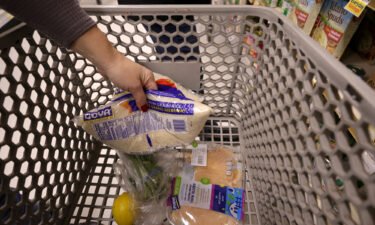 An Instacart shoppers places items in a cart at a ShopRite on January 08
