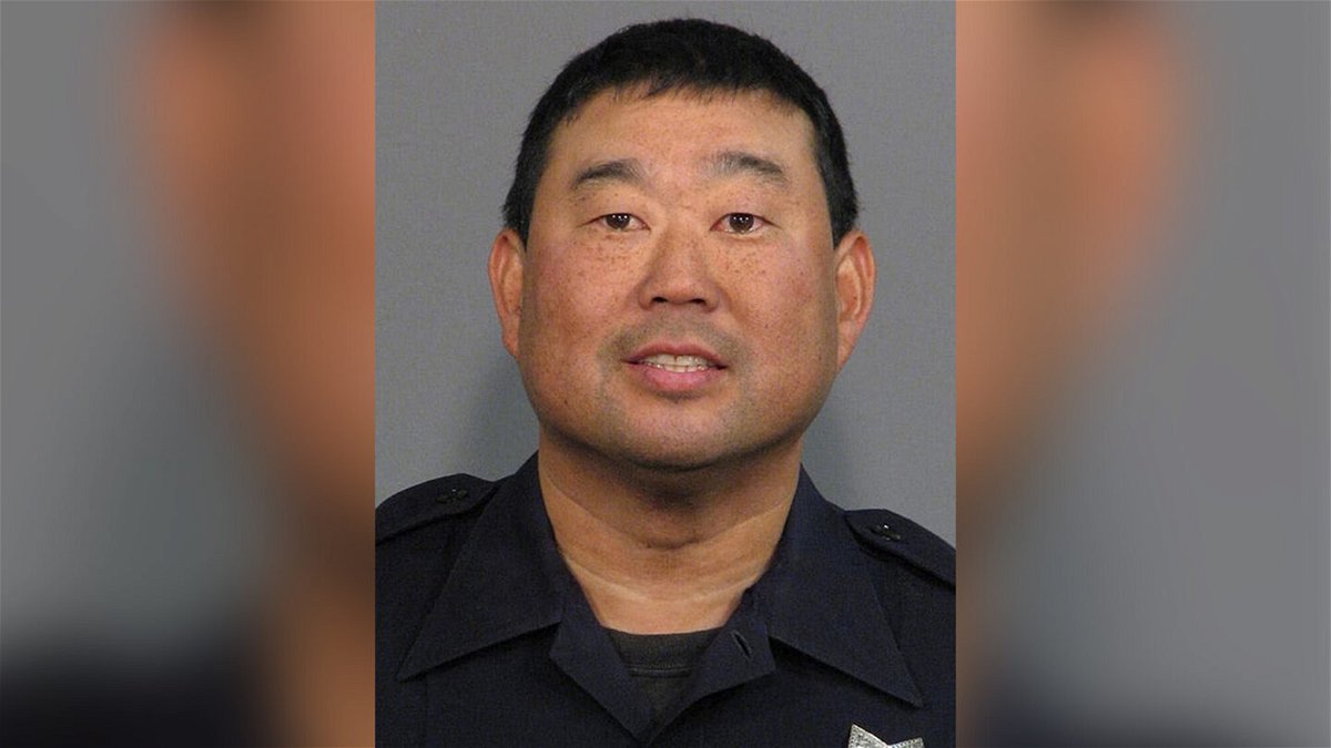 <i>San Jose Police Department/AP</i><br/>Former San Jose police officer Kevin Nishita is pictured in 2011. Police are holding two men on homicide charges and are seeking a third in the killing of a former police officer who was working security for a TV news crew in Oakland