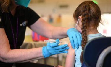 A nurse administers a pediatric dose of the Covid-19 vaccine to a girl in Los Angeles on January 19. Covid-19 vaccines could be authorized for the United States' youngest children as early as June.