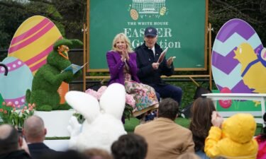 President Joe Biden and First Lady Jill Biden read a book to children during the annual Easter Egg Roll on the South Lawn of the White House in Washington