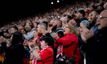 Liverpool fans observe a minutes applause to show support for Cristiano Ronaldo of Manchester United during the Premier League match between Liverpool and Manchester United on April 19