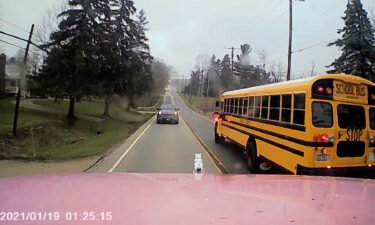 A screengrab of a tractor trailer dashcam video that nearly hit a school bus filled with children.