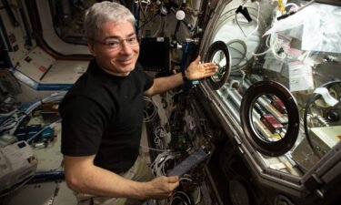 NASA astronaut and Expedition 66 Flight Engineer Mark Vande Hei sets up hardware inside the Microgravity Science Glovebox for the InSPACE-4 space physics experiment.