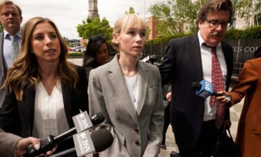 Sherri Papini walks to the federal courthouse accompanied by her attorney