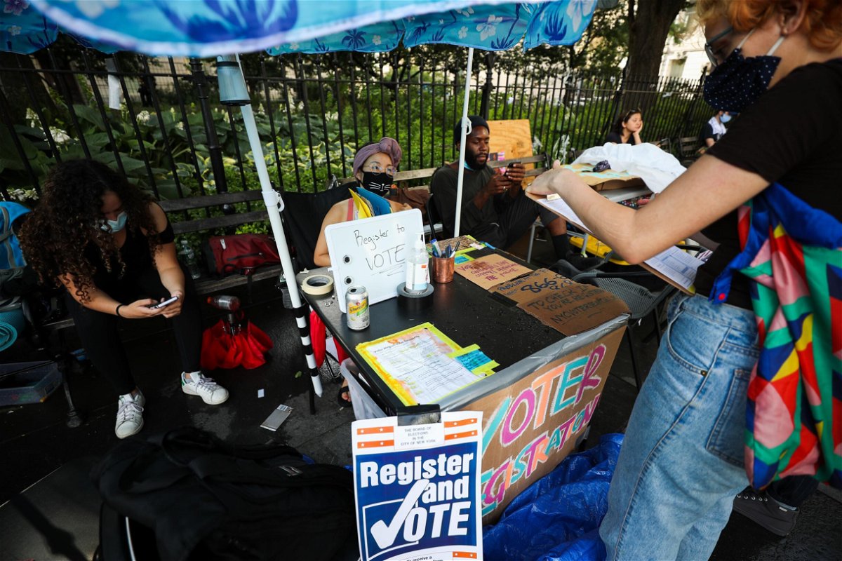 <i>Tayfun Coskun/Anadolu Agency/Getty Images</i><br/>Voting registration stand is seen during the hundreds of Black Lives Matter protesters congregate at the City Hall in 2020 in New York.