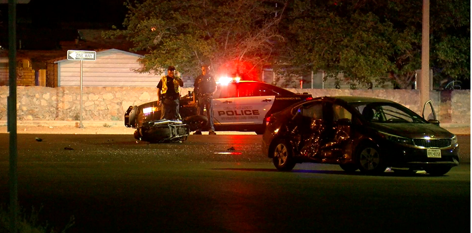 Police officers investigate a fatal crash in northeast El Paso 