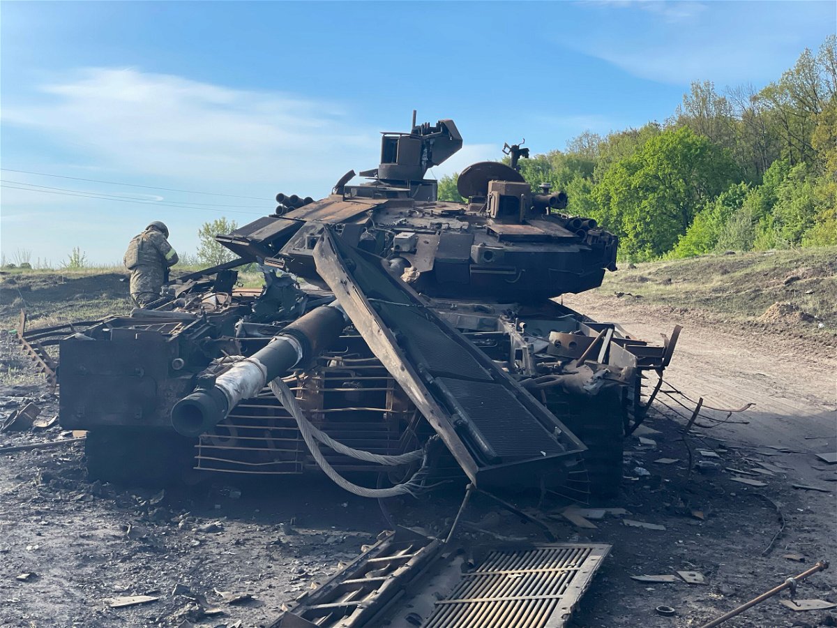 <i>Nick Paton Walsh/CNN</i><br/>Two convoys of civilian cars in one northeastern Ukrainian village speak of Russia's retreat from the area and the brutality it left behind. The remains of a Russian T90M tank destroyed days earlier is pictured here.