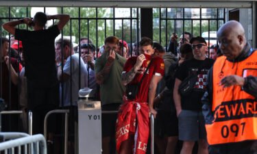 Liverpool fans are held at the gates -- with many feeling the effects of tear gas -- ahead of the Champions League final.