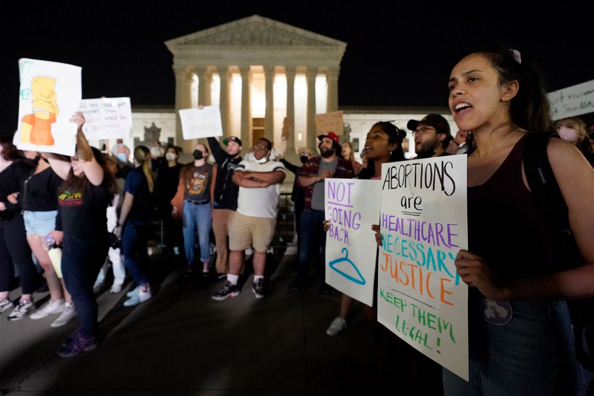 <i>Alex Brandon/AP</i><br/>A crowd of people gather outside the Supreme Court on May 3 in Washington