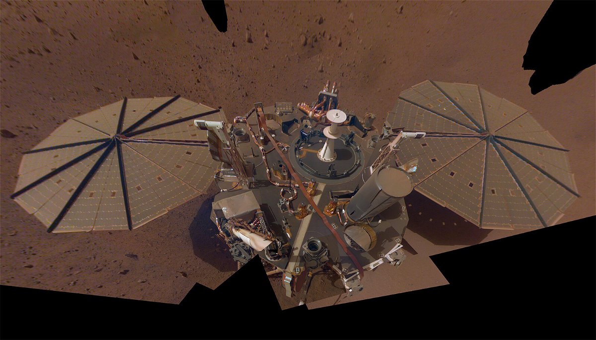 <i>NASA/JPL-Caltech</i><br/>A selfie captured by InSight shows a buildup of dust on its solar panels. The NASA InSight lander