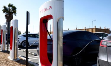 Tesla cars recharge at a Tesla Supercharger station on April 14 in Pasadena