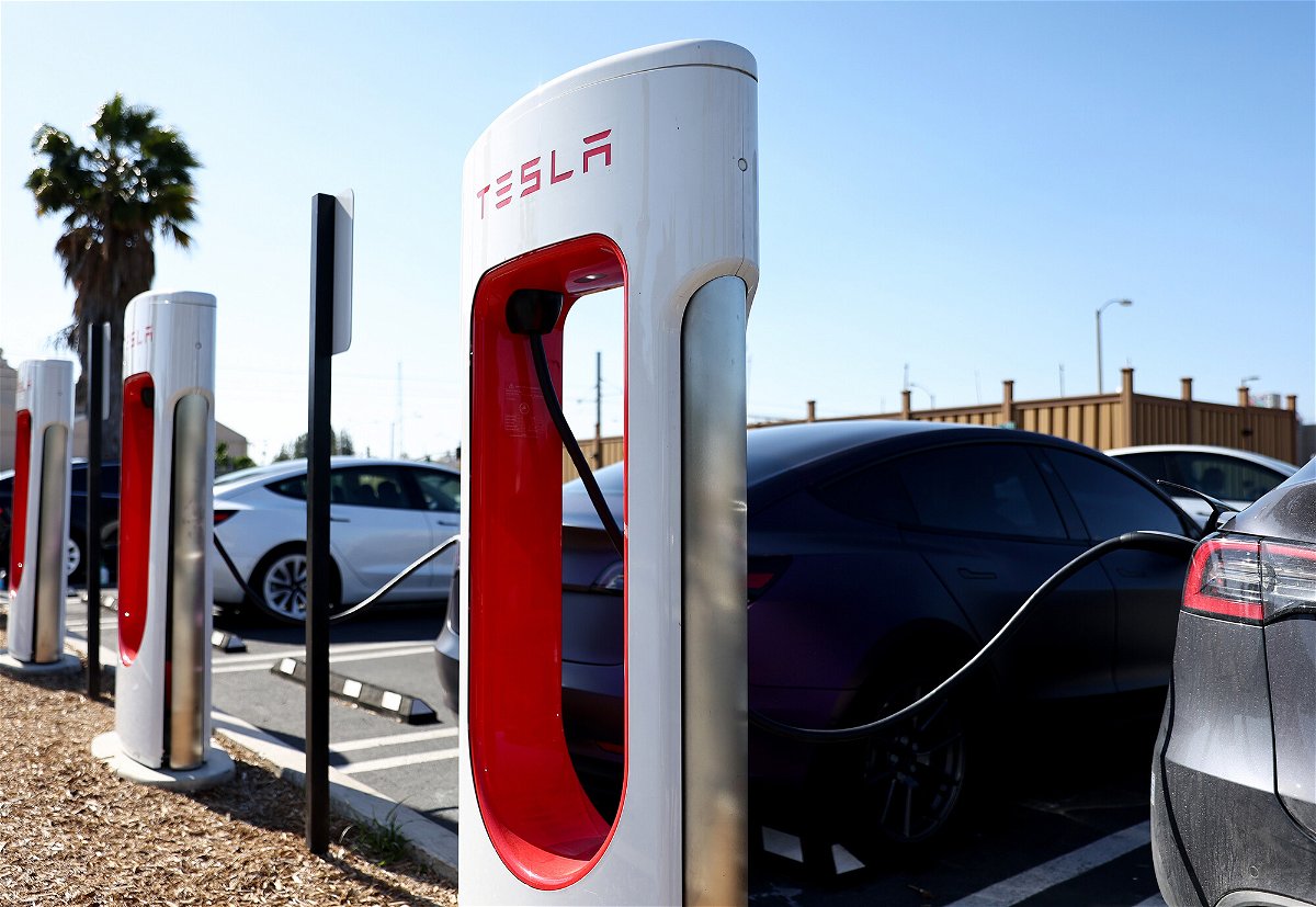 <i>Mario Tama/Getty Images</i><br/>Tesla cars recharge at a Tesla Supercharger station on April 14 in Pasadena