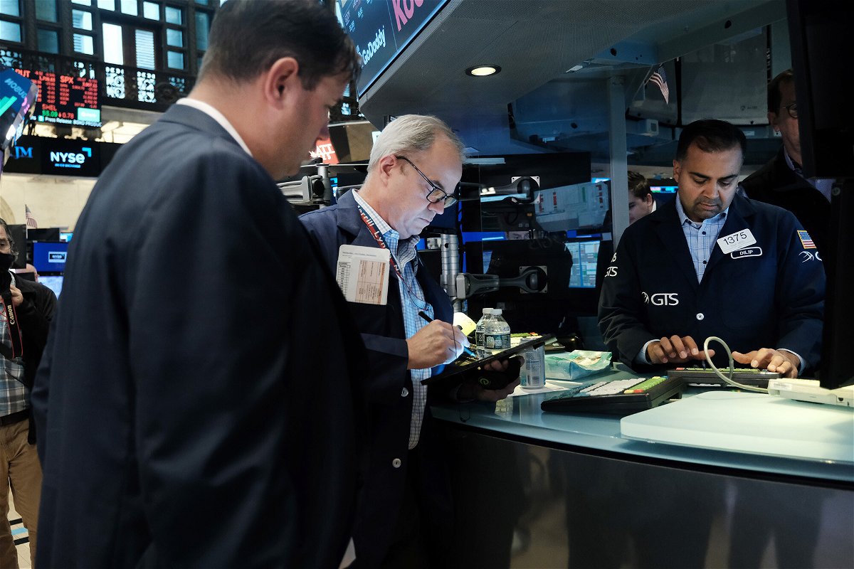 <i>Spencer Platt/Getty Images</i><br/>Traders work on the floor of the New York Stock Exchange (NYSE) on May 12. Bank shares have dropped below where they stood in February 2020