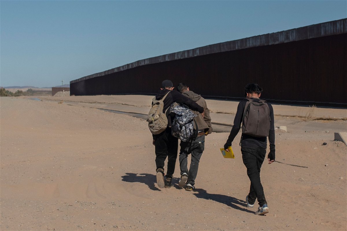 <i>Felix Marquez/AP</i><br/>Nicaraguan migrants walk on the US-Mexico border