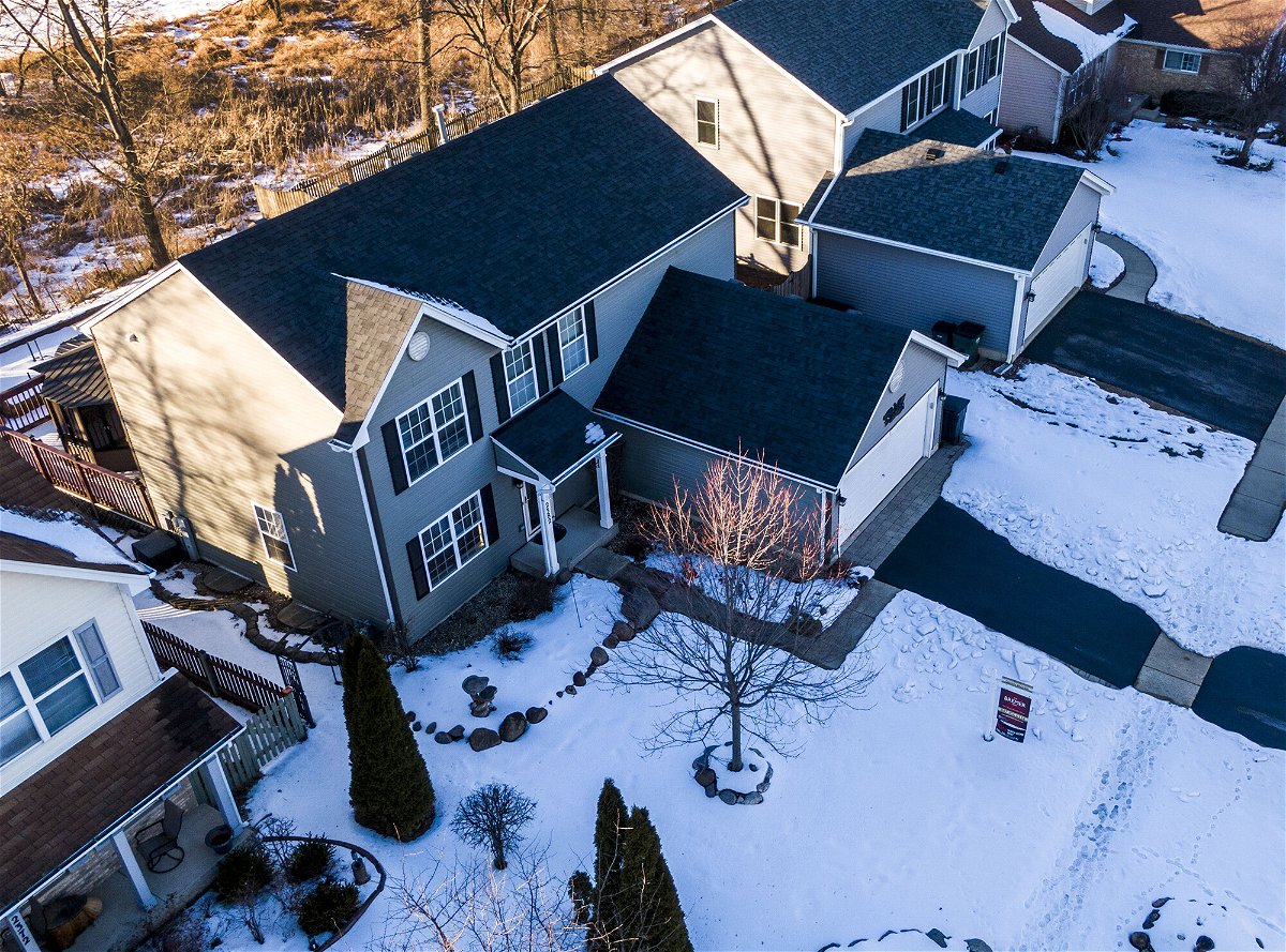<i>Tannen Maury/EPA-EFE/Shutterstock</i><br/>An aerial photo made with a drone shows a house for sale in Round Lake Heights