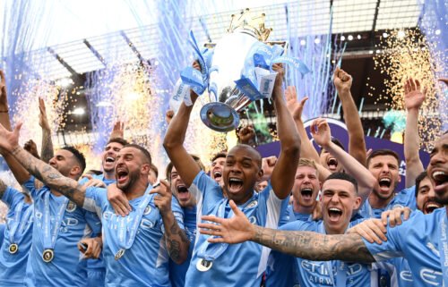 Manchester City lifts the trophy after a memorable title race against Liverpool.