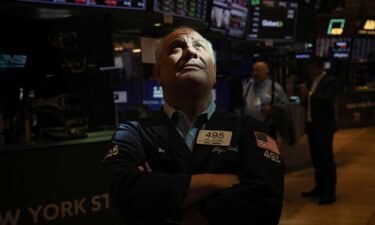 Trader Joel Lucchese works on the floor of the New York Stock Exchange (NYSE) in New York City