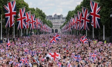 Crowds fill The Mall as they wait for the royal family to appear on the balcony of Buckingham Palace on the first day of celebrations for the Queen's Platinum Jubilee on Thursday.