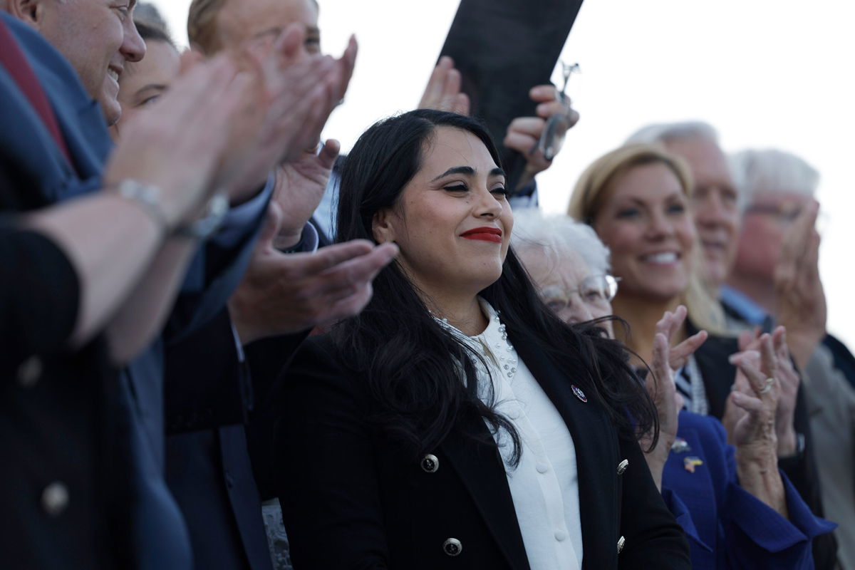 <i>Anna Moneymaker/Getty Images</i><br/>Rep. Mayra Flores is applauded by House Republicans at a news conference after being sworn in at the Capitol on Tuesday