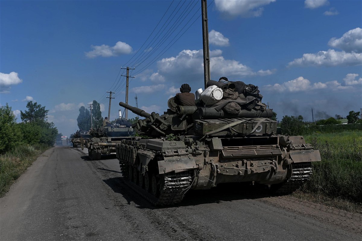 <i>Justin Yau/Sipa USA/Reuters</i><br/>A column of Ukrainian army tanks rolls down a road near Lysychansk on June 19.