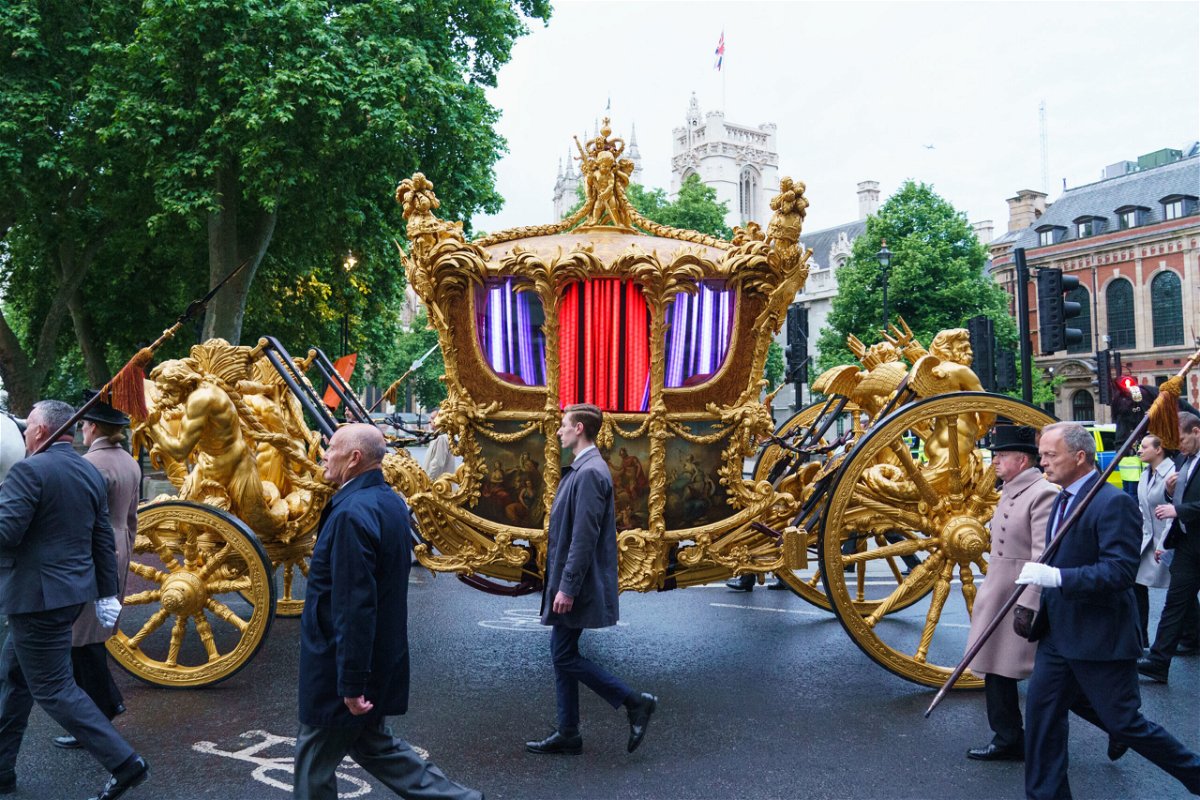 <i>Dominic Lipinski/PA Images/Getty Images</i><br/>The gold state coach during an early morning rehearsal as service personnel from the Royal Navy