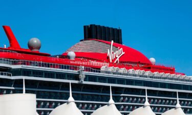An outside view of Virgin Voyages' Scarlet Lady cruise ship docked at PortMiami on September 28