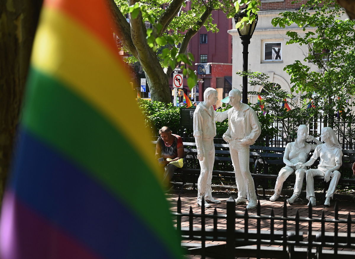 <i>Angela Weiss/AFP/Getty Images</i><br/>Rainbow flags and sculptures are seen at the Stonewall National Monument in New York City.