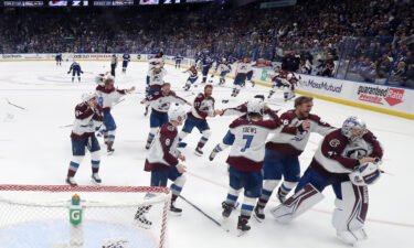 Colorado Avalanche players celebrate after defeating the Tampa Bay Lightning in Game Six of the Stanley Cup Finals.