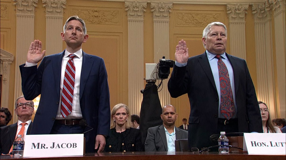 <i>Pool</i><br/>Greg Jacob and J. Michael Luttig are sworn in before testifying during the hearing on June 16.