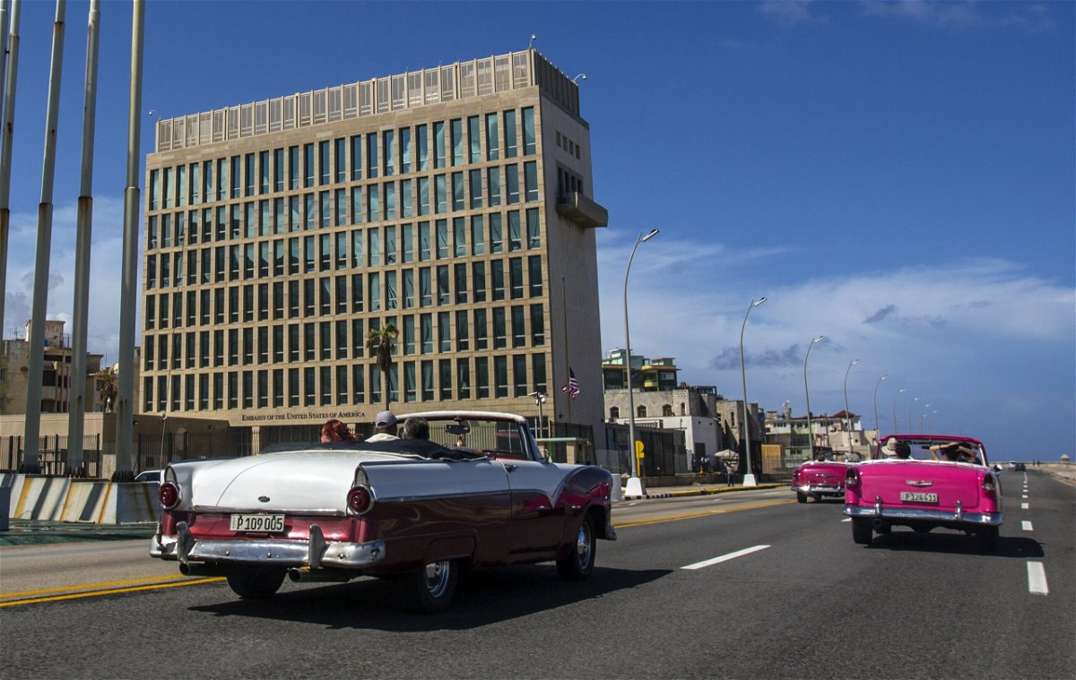<i>Desmond Boylan/AP</i><br/>Tourists ride classic convertibles in Havana