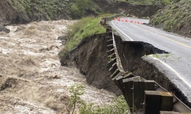 A road in Yellowstone National Park partially collapsed due to flooding Monday.