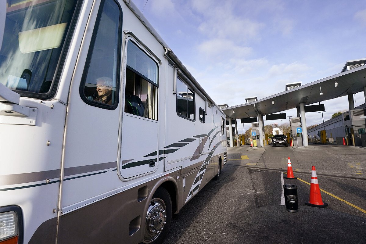 <i>Elaine Thompson/AP</i><br/>An RV driver heads into the U.S. from Canada after passing through the Peace Arch border crossing Monday