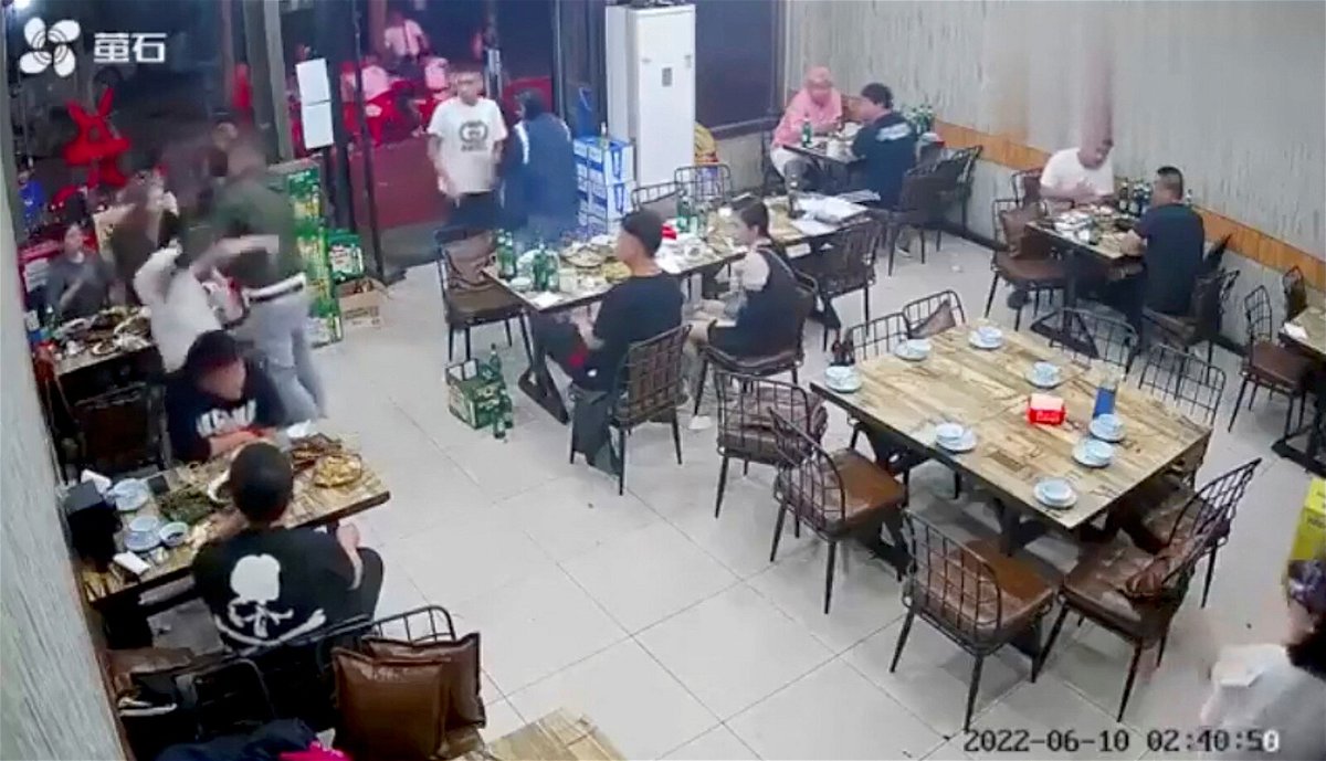 <i>Reuters</i><br/>A man assaults a woman at a restaurant in the northeastern city of Tangshan
