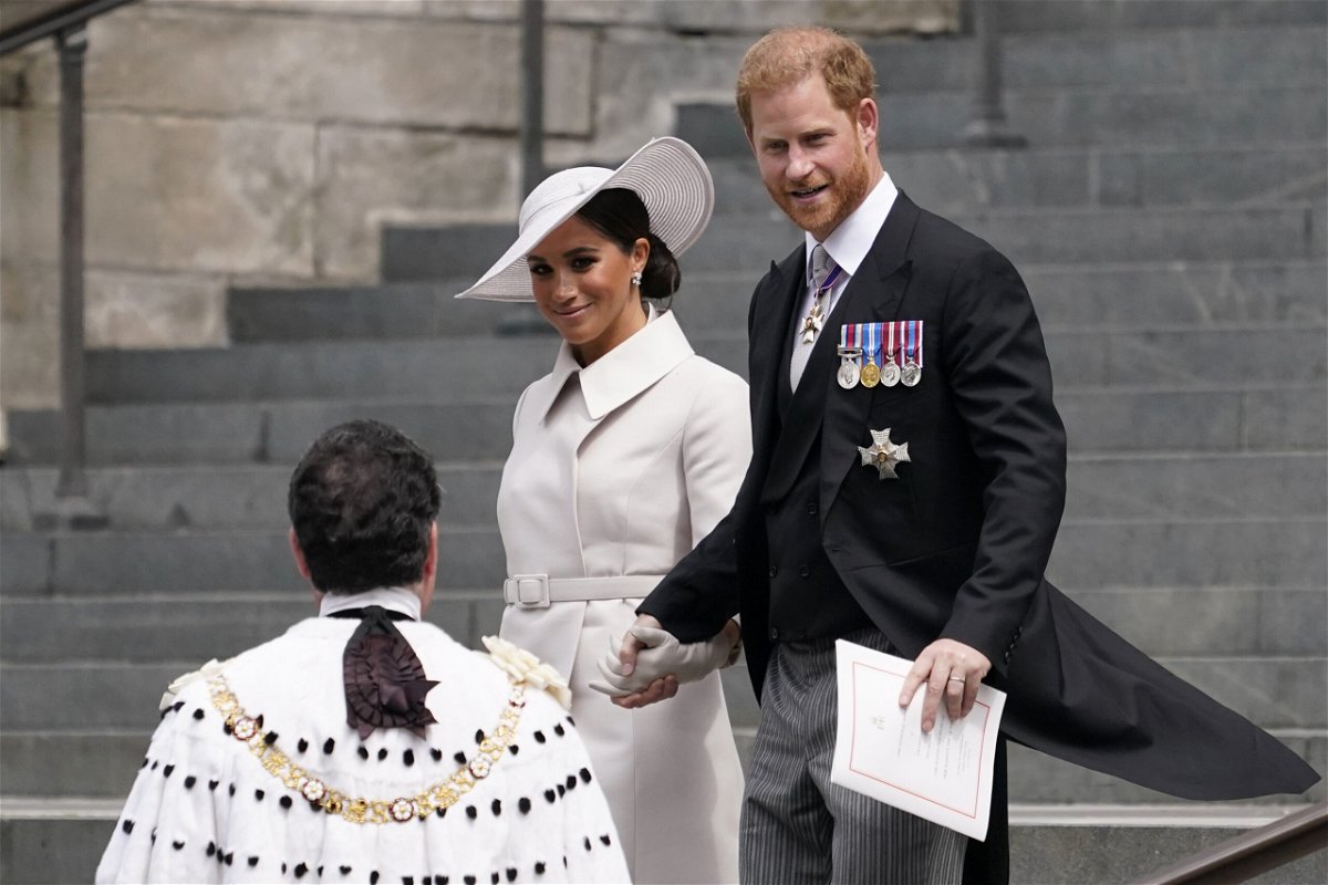 <i>Alberto Pezzali/AP</i><br/>Prince Harry and his wife Meghan