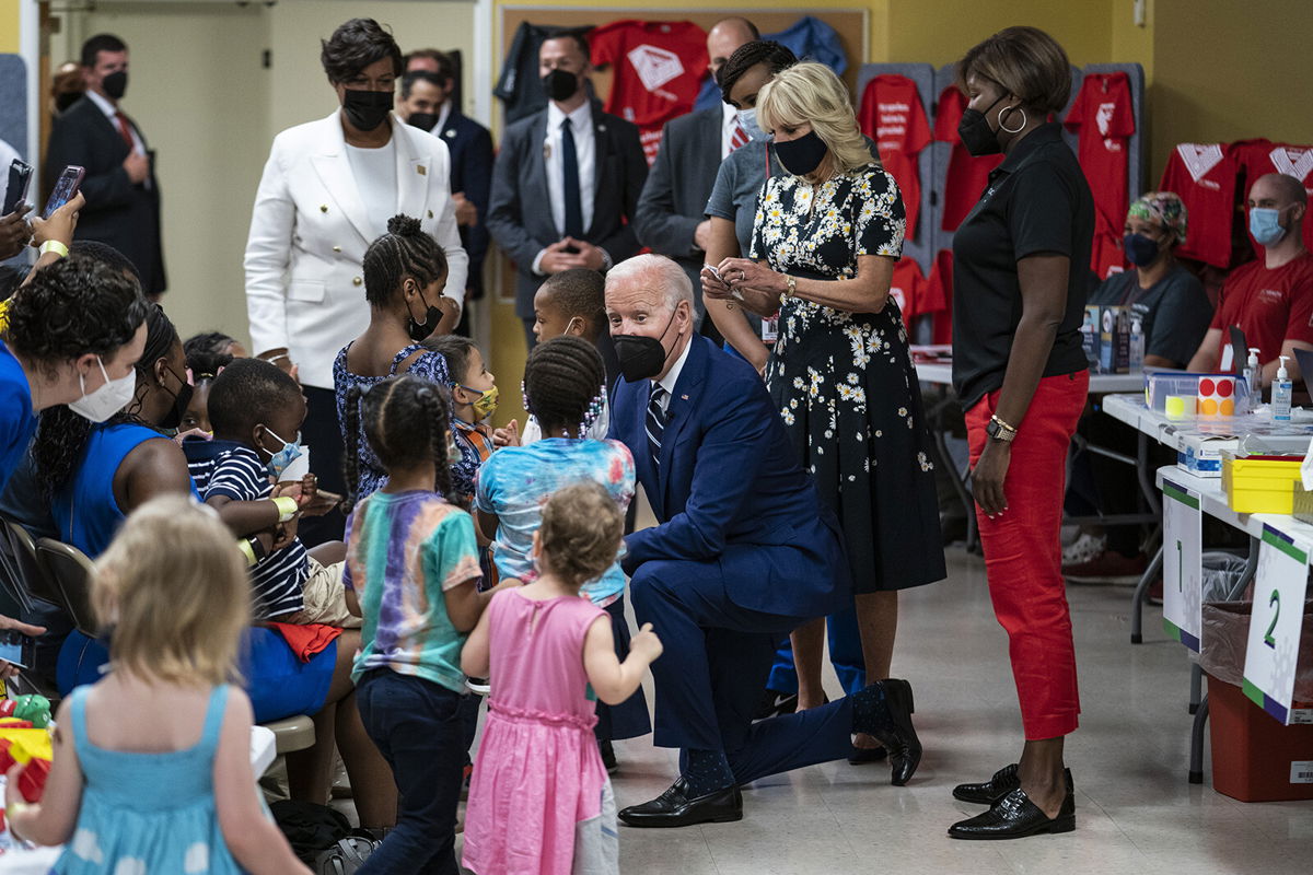 <i>Sarah Silbiger/Bloomberg/Getty Images</i><br/>US President Joe Biden speaks with children while visiting a Covid-19 vaccination clinic hosted by the District of Columbia's Department of Health in Washington