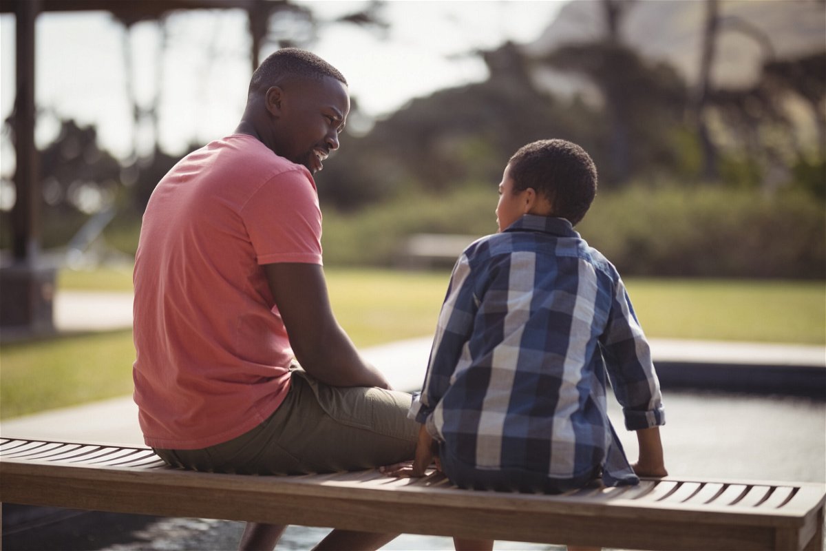 <i>Adobe Stock</i><br/>How to talk to boys about being a boy. Fathers can be role models to their sons by showing them how to talk about their feelings.