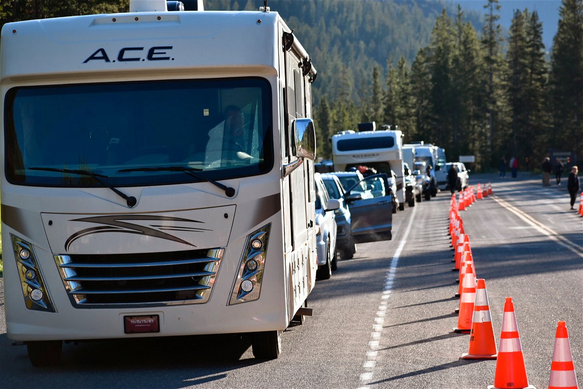 <i>Matthew Brown/AP</i><br/>Dozens of vehicles lined up outside Yellowstone National Park's entrance on Wednesday