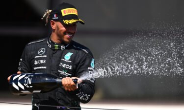 Lewis Hamilton celebrates on the podium after coming second in the French Grand Prix. Hamilton estimated he lost "around three kilos" during the French Grand Prix after a drinks bottle malfunction left him unable to rehydrate.