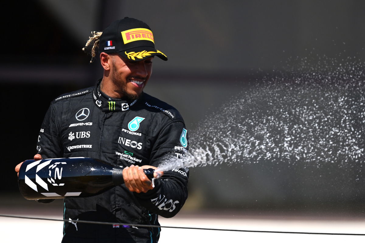 <i>Dan Mullan/Getty Images Europe/Getty Images</i><br/>Lewis Hamilton celebrates on the podium after coming second in the French Grand Prix. Hamilton estimated he lost 