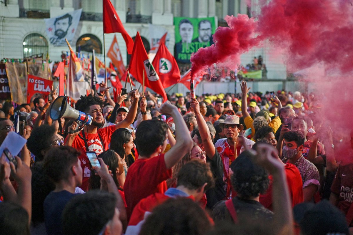 <i>Mauro Pimentel/AFP/Getty Images</i><br/>Supporters of Brazil's former president (2003-2010) and presidential pre-candidate for the Workers Party (PT) Luiz Inacio Lula da Silva